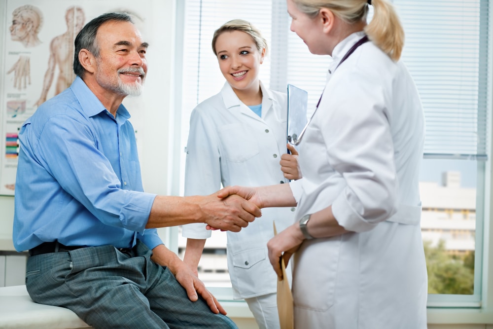 Doctor,Shakes,Hands,With,A,Senior,Patient